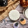 Mini Halloween cookie cutter and fondant stamp set including spider, web and cobweb on a Halloween-themed plate, 3D-printed from biodegradable food-safe PLA