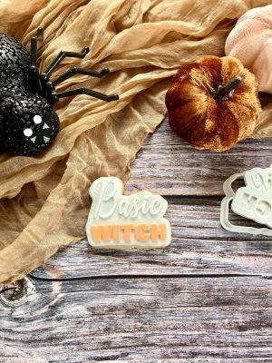 Basic Witch cookie cutter and fondant stamp displayed on a Halloween-themed plate with autumn props, 3D-printed from biodegradable food-safe PLA
