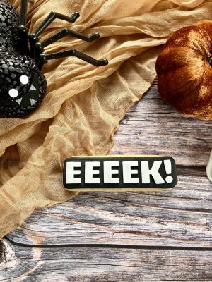 Eeeek cookie cutter and fondant stamp displayed on a Halloween-themed surface, 3D-printed from biodegradable food-safe PLA