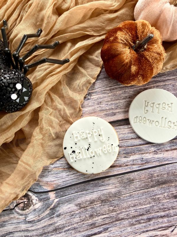 7cm round Happy Halloween fondant embosser with spooky text, displayed on themed fondant, 3D-printed from biodegradable food-safe PLA