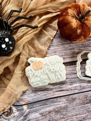 “A Little Pumpkin is on the Way” cookie cutter and fondant embosser set displayed on a cosy autumn-themed plate, 3D-printed from biodegradable food-safe PLA