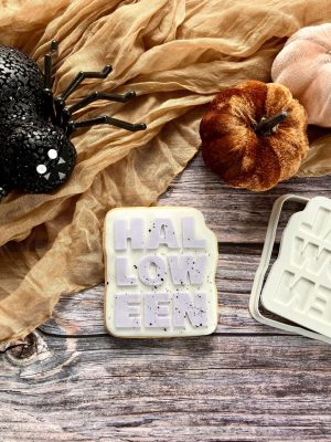 Halloween cookie cutter and fondant stamp with bold embossed lettering, displayed on a themed plate, 3D-printed from biodegradable food-safe PLA