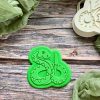 Snake cookie cutter and fondant embosser set displayed on a green plate, 3D-printed from biodegradable food-safe PLA