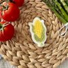 79E8D1BD-2625-4E2D-99D1-A1617BF7BFBD Corn cob cookie cutter and fondant embosser on woven mat with tomatoes