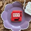 777 slot machine cookie cutter and fondant stamp on purple plate