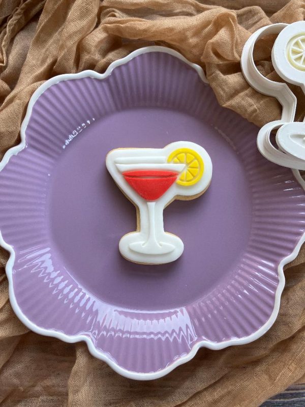 Cocktail cookie cutter and fondant stamp on purple plate