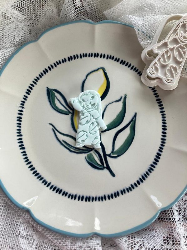 Lilo Cookie Cutter and Fondant Stamp Lilo cookie cutter and fondant stamp on decorated plate