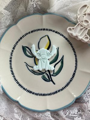 Stitch cookie cutter and fondant stamp set featuring Lilo & Stitch design displayed on a decorative plate, 3D-printed from biodegradable food-safe PLA