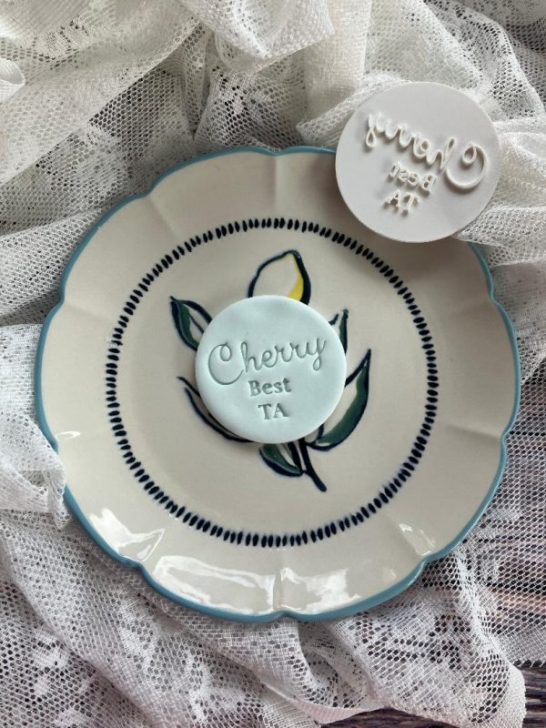 Cherry Best TA cookie stamp embossed fondant design on cookie with message "Cherry Best TA"