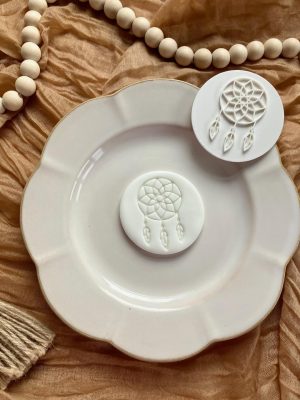 7cm fondant stamp of a dream catcher with feathers and circular web