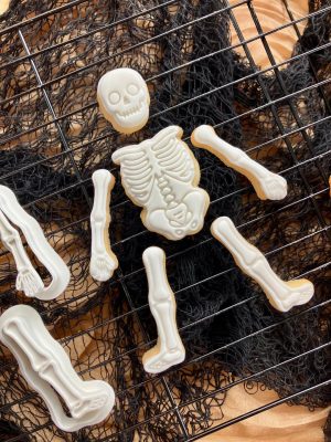 Build-a-skeleton cookie cutter and fondant embosser set with six body part shapes