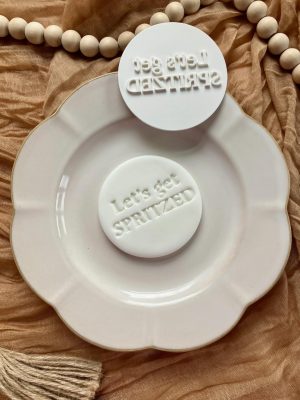 8cm fondant stamp with the phrase ‘Let’s Get Spritzed’ in playful font