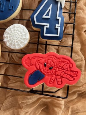 8cm cookie cutter and fondant embosser of spider hero in crouching action pose with web detail