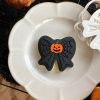 Pumpkin & Spiderweb Bow Cookie Cutter โ Halloween Embosser (8cm) 8cm bow-shaped cookie cutter and fondant embosser with pumpkin centre and spiderweb pattern
